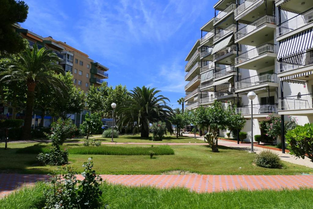 a park in front of a building at Rentalmar Aries Plus in Salou