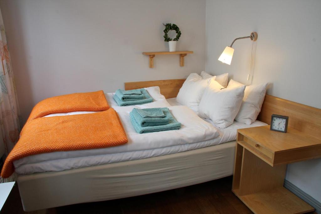 Postel nebo postele na pokoji v ubytování Hotell Oskar