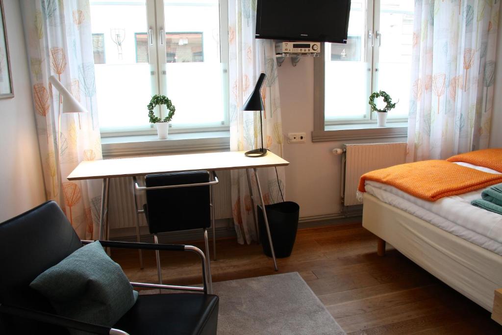 Postel nebo postele na pokoji v ubytování Hotell Oskar