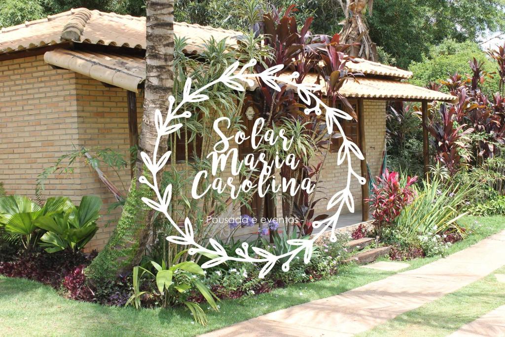 um sinal para um centro de jardim num jardim em Solar Maria Carolina em Mario Campos