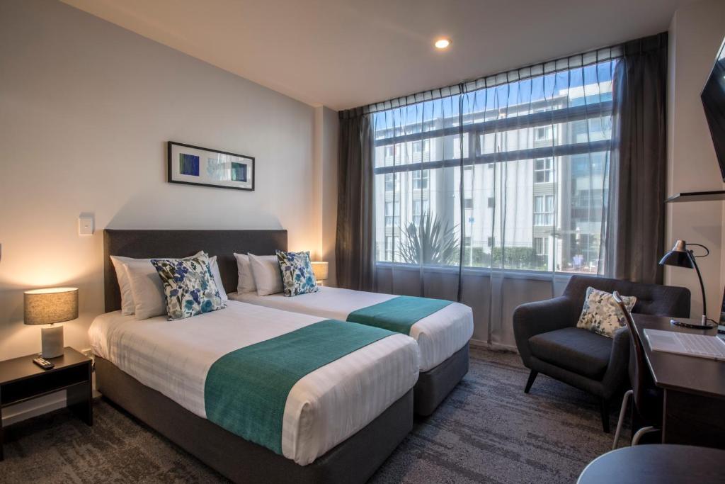 Voodi või voodid majutusasutuse Quest Henderson Apartment Hotel toas
