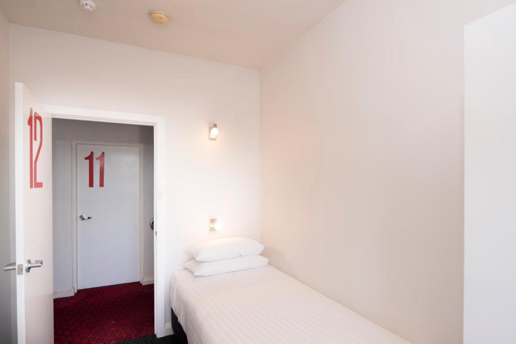 Postel nebo postele na pokoji v ubytování Mowbray Hotel