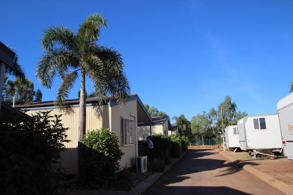 a white truck parked in front of a house at AAOK Karratha Caravan Park in Karratha