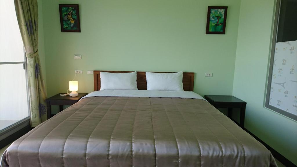 Postel nebo postele na pokoji v ubytování Kuan Min B&B