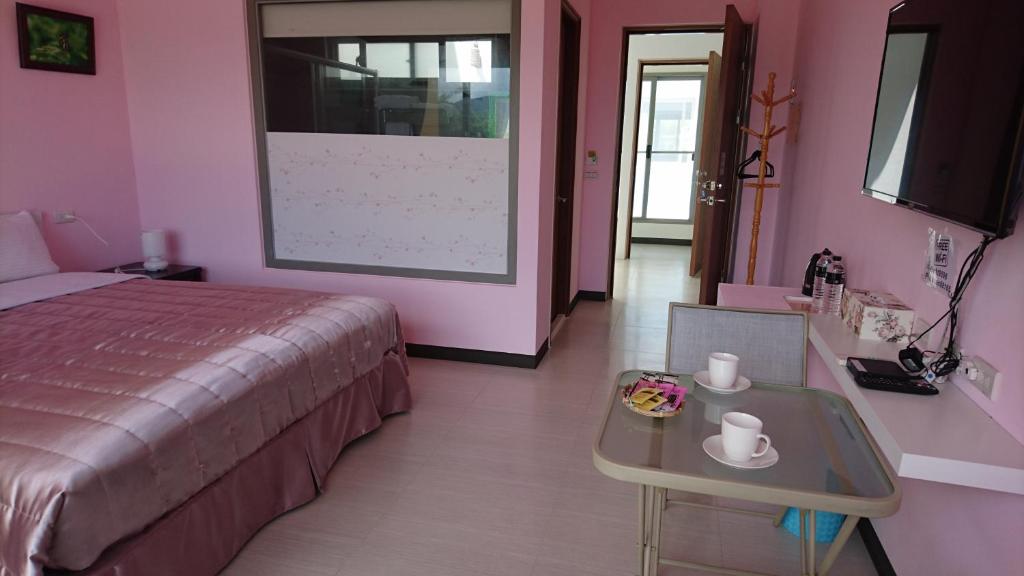Postel nebo postele na pokoji v ubytování Kuan Min B&B