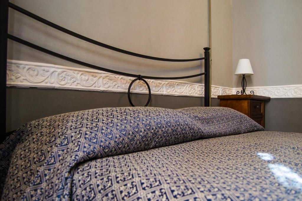 Postel nebo postele na pokoji v ubytování B&B Su Maimoni