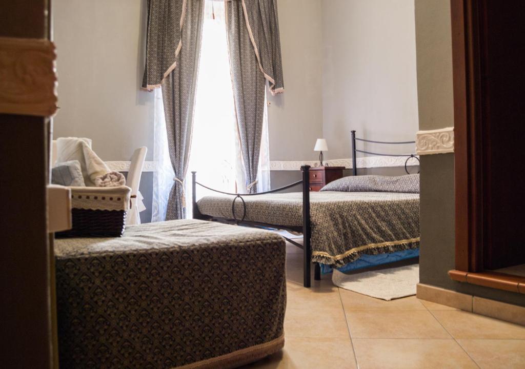 Postel nebo postele na pokoji v ubytování B&B Su Maimoni