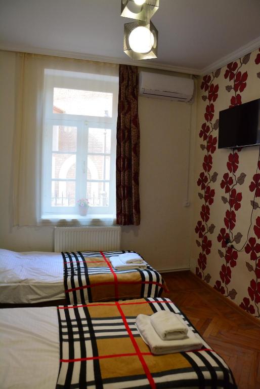 Postel nebo postele na pokoji v ubytování Hotel Canyon