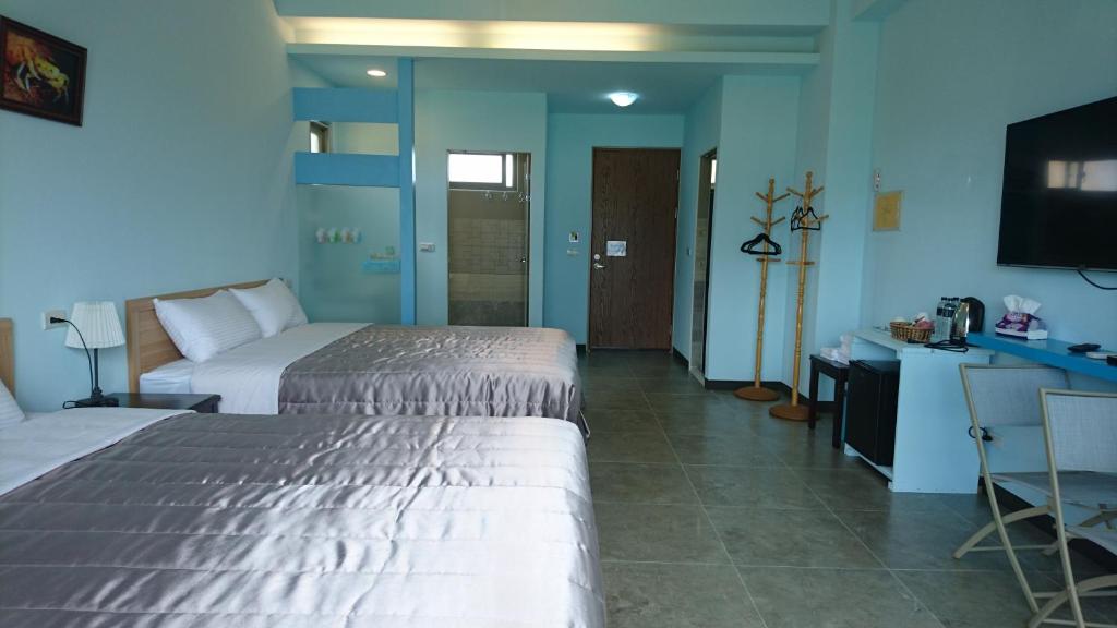Postel nebo postele na pokoji v ubytování Kuan Min B&B