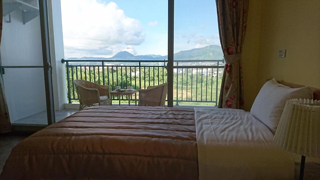 Postel nebo postele na pokoji v ubytování Kuan Min B&B