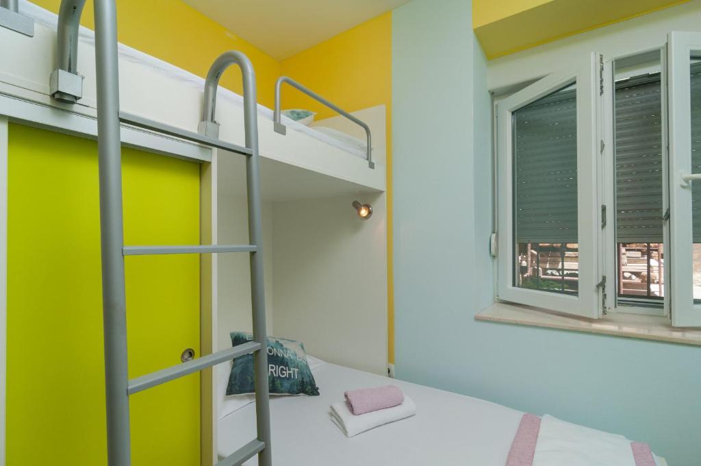 Posteľ alebo postele v izbe v ubytovaní Split Center Apartment