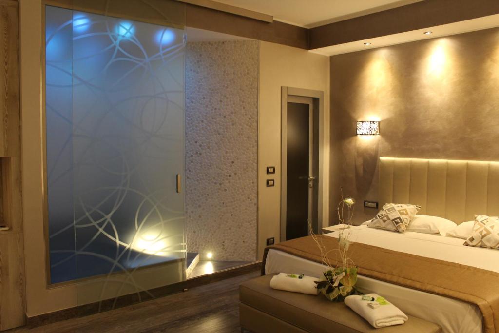 Łóżko lub łóżka w pokoju w obiekcie Hotel Aquila