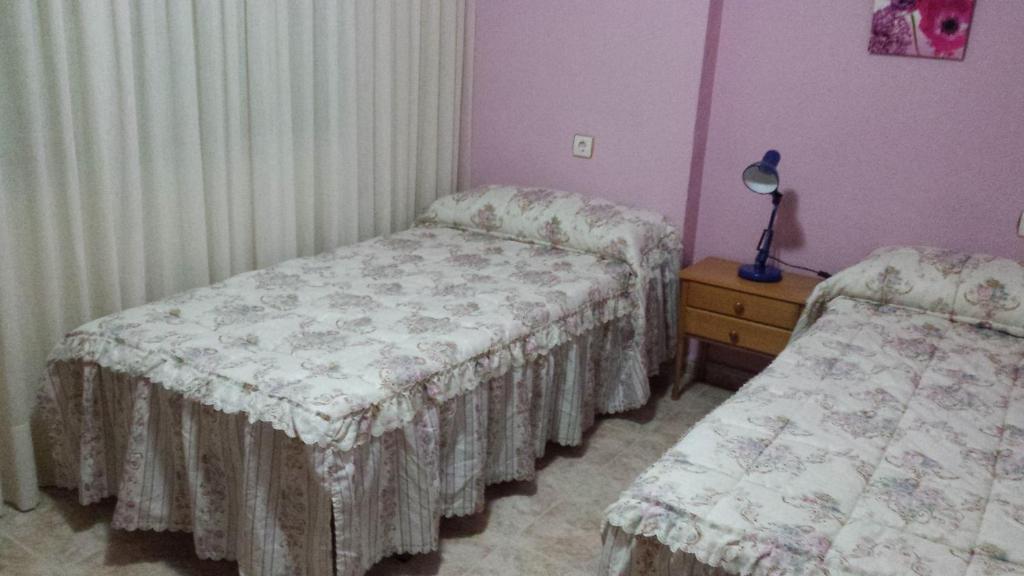 Posteľ alebo postele v izbe v ubytovaní Palmeral de Torrevieja