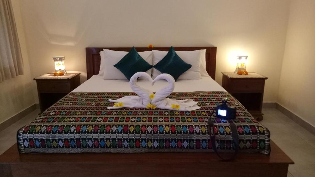 Postel nebo postele na pokoji v ubytování Krisda Ubud Guest House