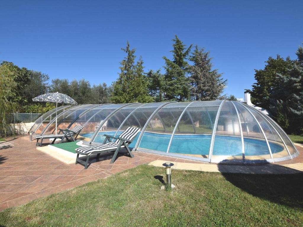 a swimming pool with a glass igloo at Spacious Holiday Home in Verteneglio in Brtonigla
