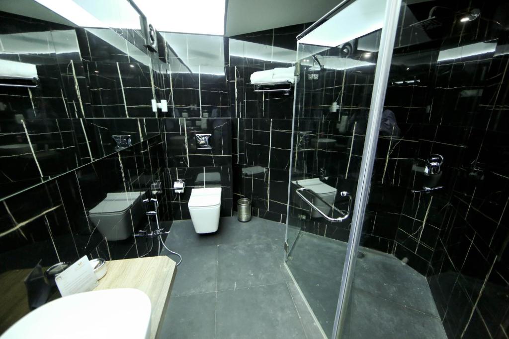 Koupelna v ubytování Hotel President