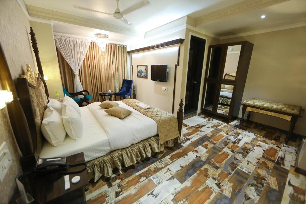 Postel nebo postele na pokoji v ubytování Hotel President