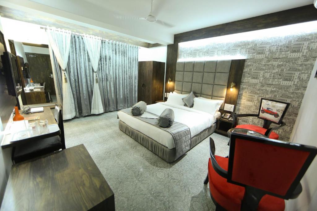 Postel nebo postele na pokoji v ubytování Hotel President