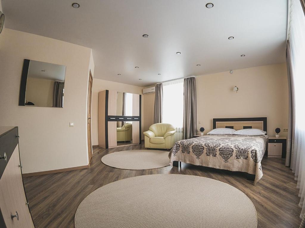 Кровать или кровати в номере Отель Классик