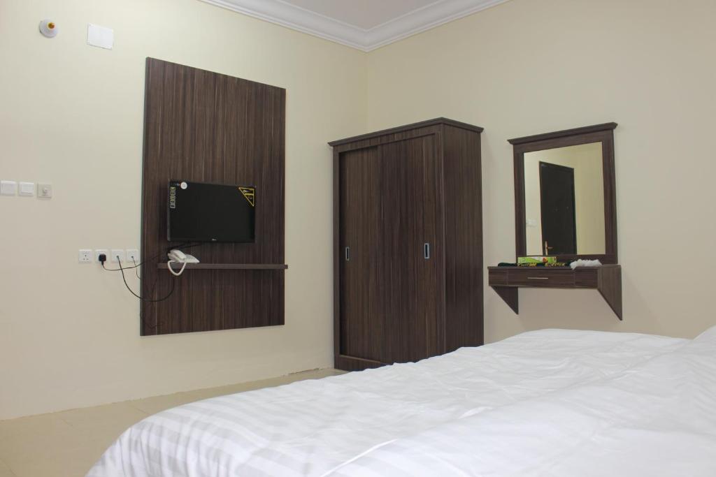 Postel nebo postele na pokoji v ubytování Rayanat Abha Aparthotel