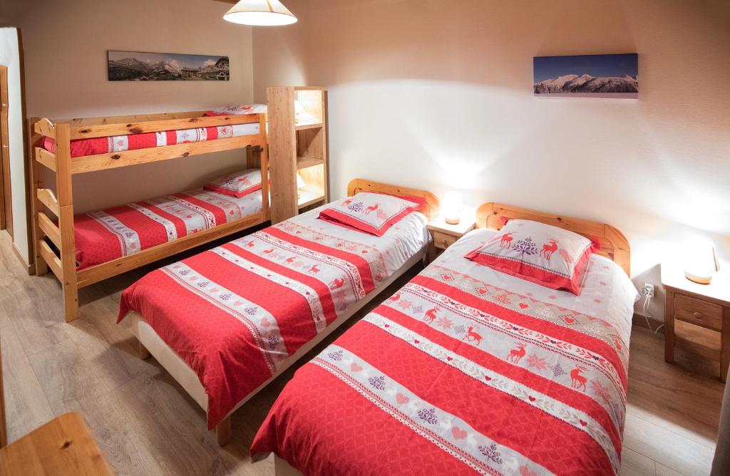 Postel nebo postele na pokoji v ubytování La Roche du Croue