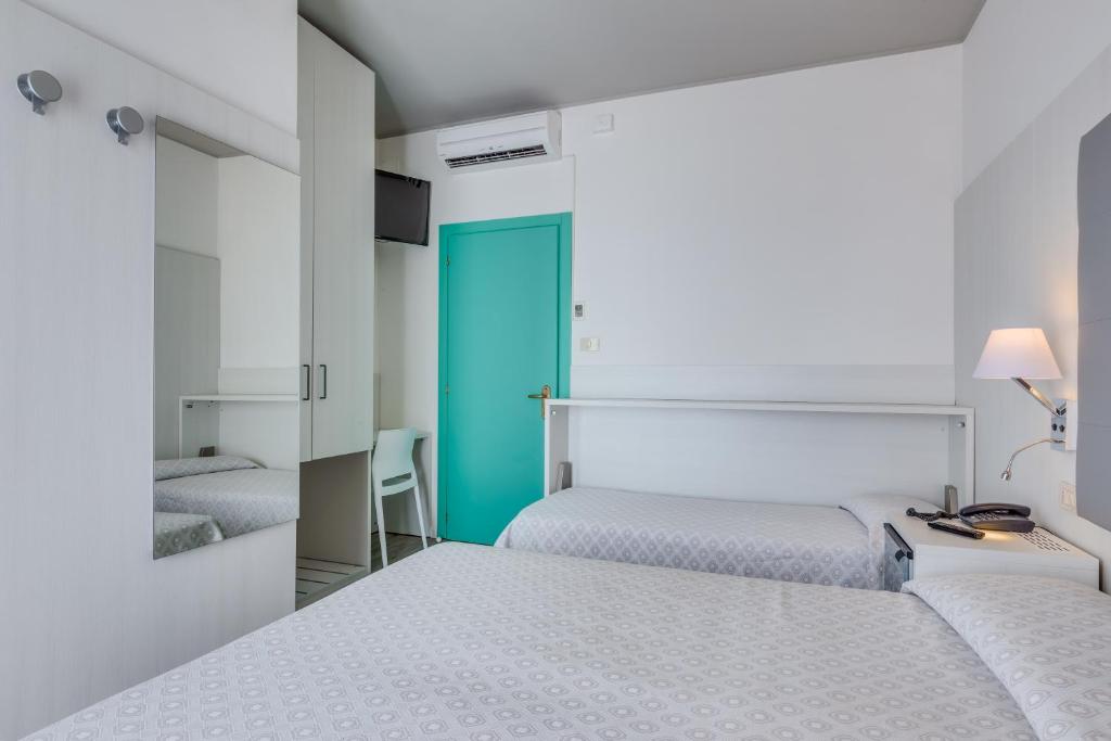 Postel nebo postele na pokoji v ubytování Hotel Garni' Serena