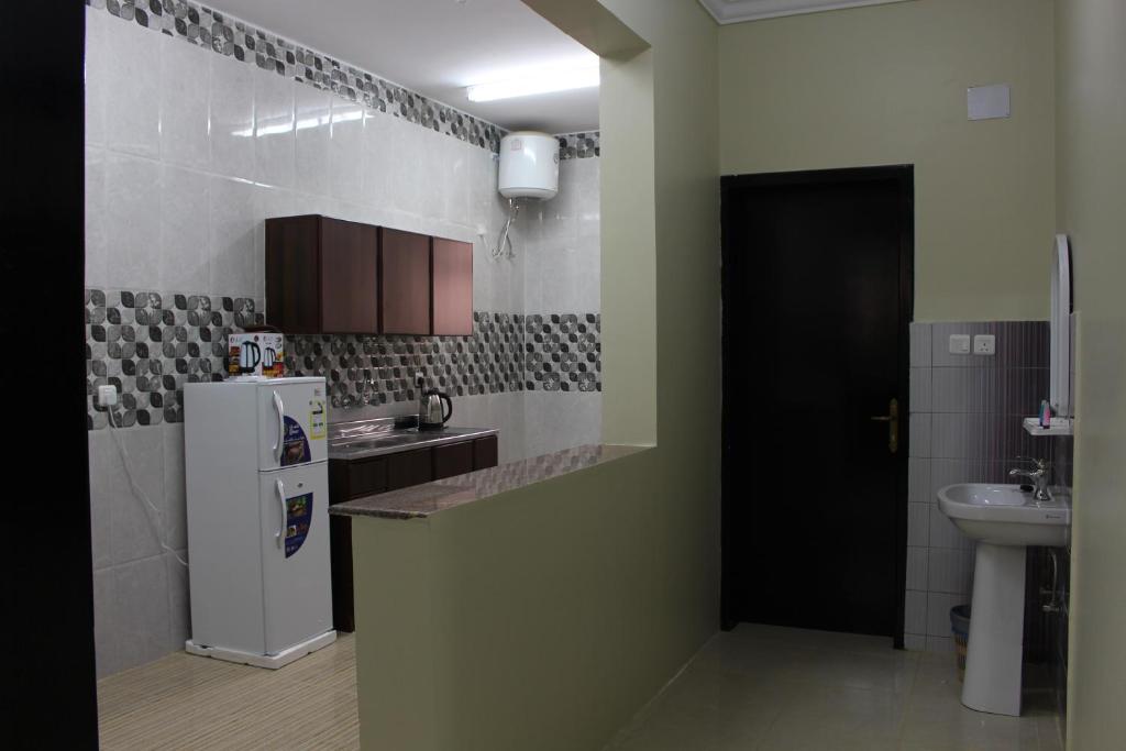 Kuchyň nebo kuchyňský kout v ubytování Rayanat Abha Aparthotel