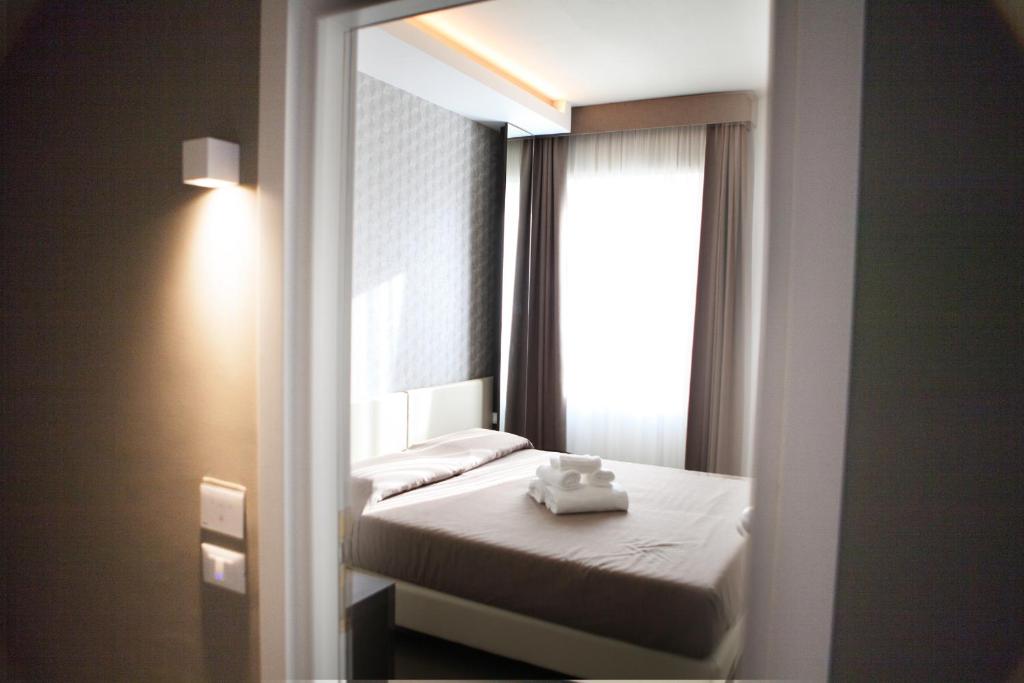 Posteľ alebo postele v izbe v ubytovaní Hotel Palazzo del Garda & Spa