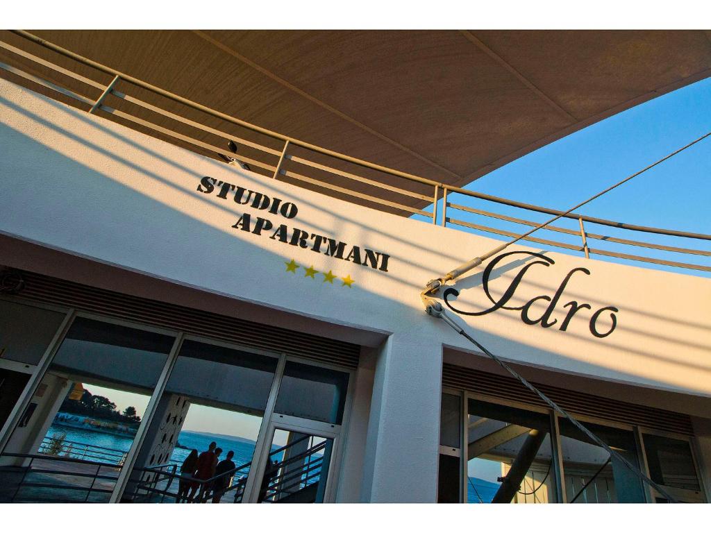 a sign on the side of a building at IDRO Studio Apartments directly at the beach in Split