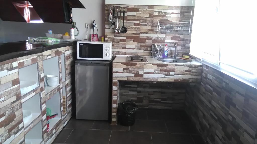 Kuchyň nebo kuchyňský kout v ubytování Zoi Residence