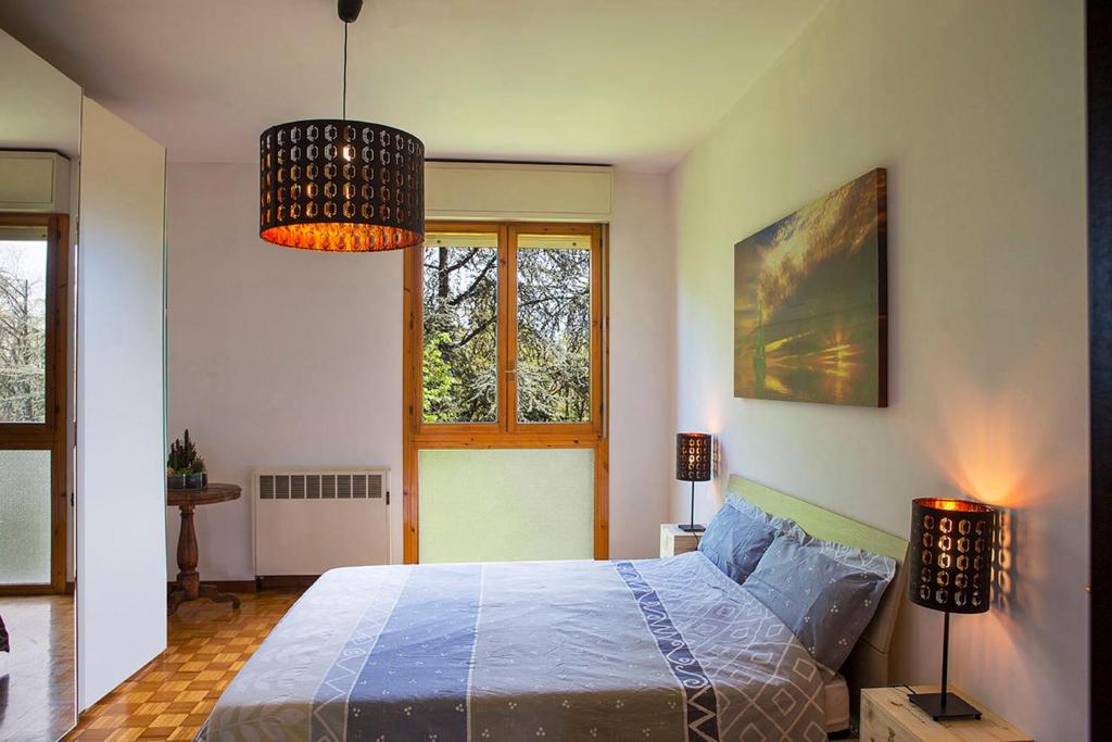 A bed or beds in a room at Residenze Bellaria Park "Riverside"