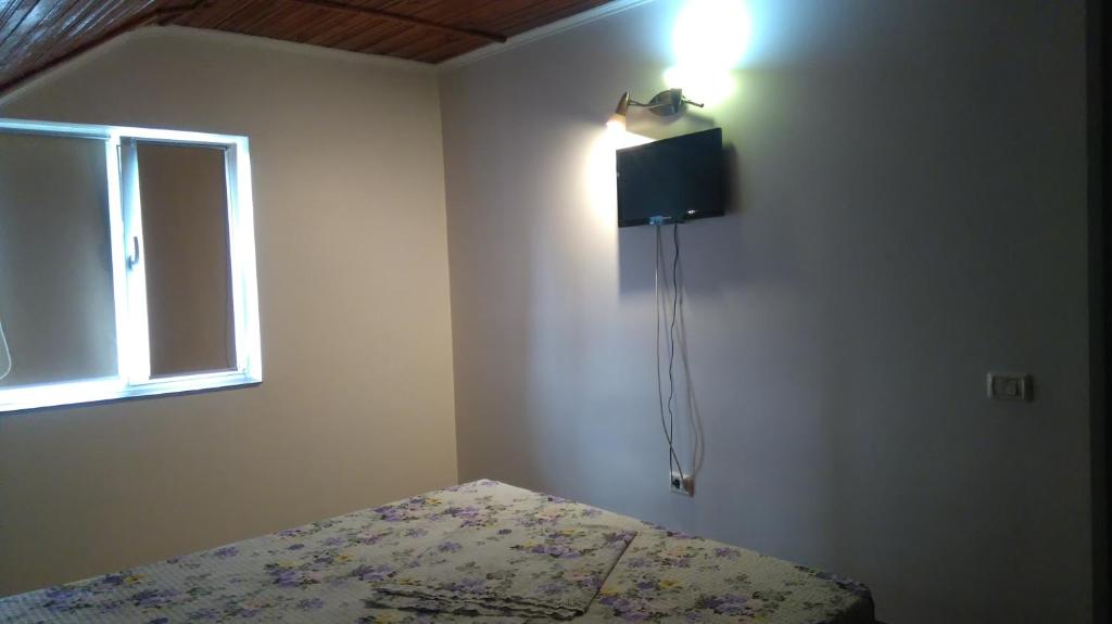 Postel nebo postele na pokoji v ubytování Zoi Residence