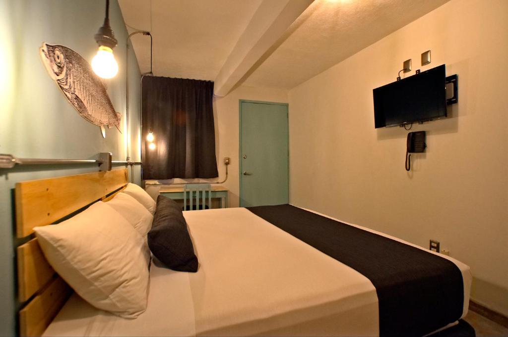 TV a/nebo společenská místnost v ubytování Mas Basico Hotel