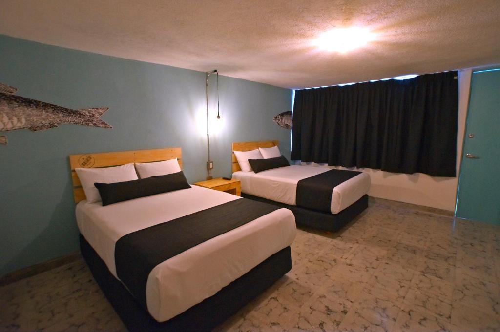 Postel nebo postele na pokoji v ubytování Mas Basico Hotel