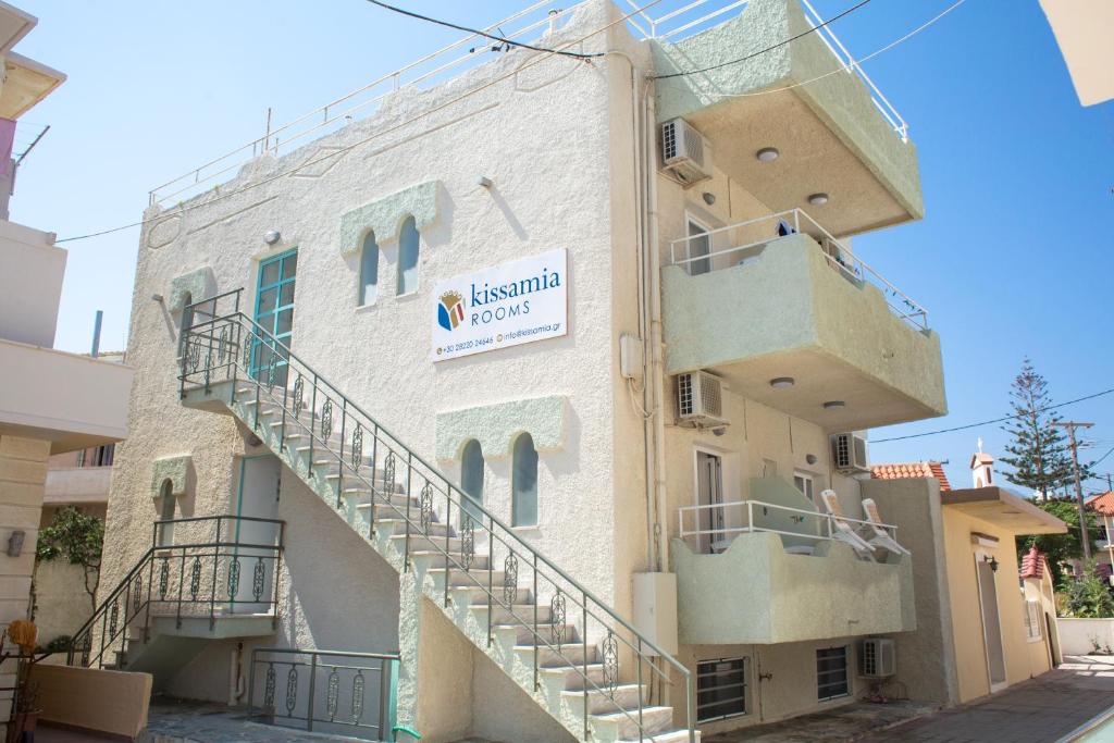 a building with stairs on the side of it at Kissamia Rooms - Next to Night Clubs in Kissamos