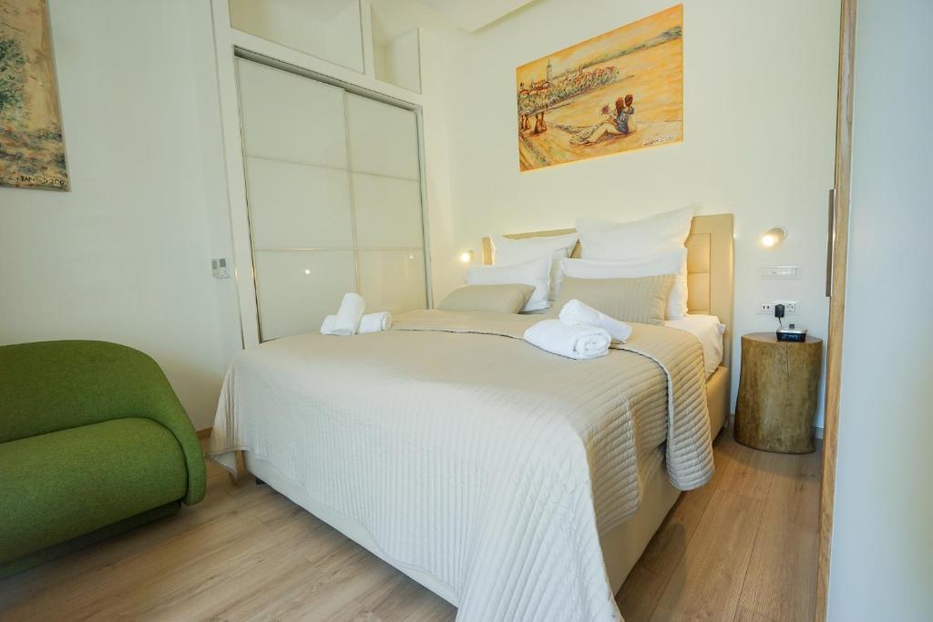Posteľ alebo postele v izbe v ubytovaní Destino City Apartments