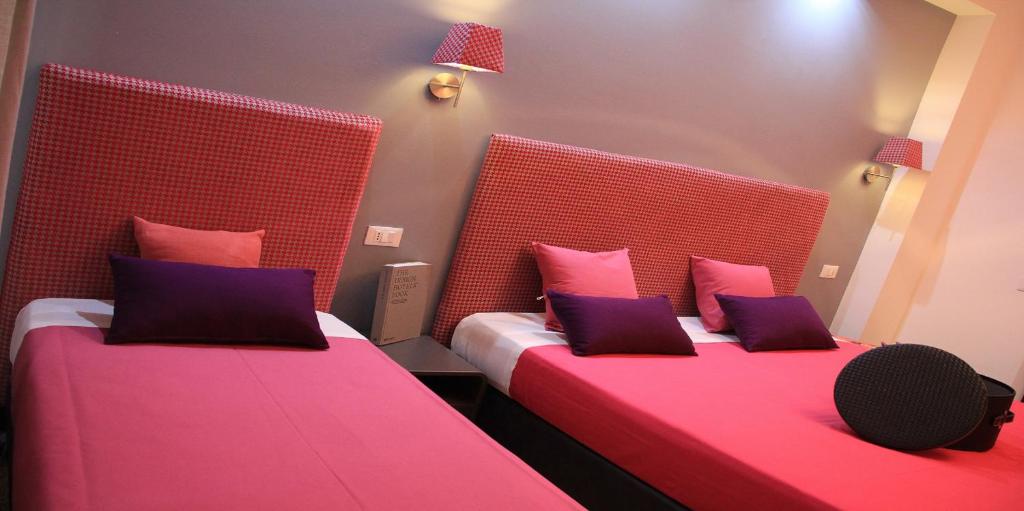 Postel nebo postele na pokoji v ubytování Hotel Bologna