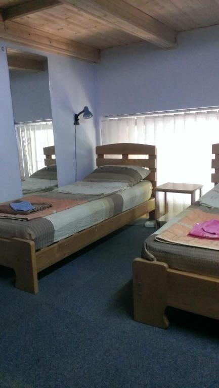 Postel nebo postele na pokoji v ubytování Guesthouse Rest