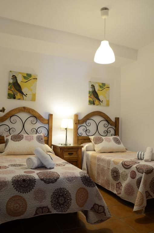 Postel nebo postele na pokoji v ubytování Casa Botero
