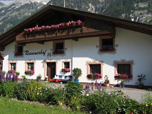 a building with flowers on the top of it at Rosumerhof in Leutasch