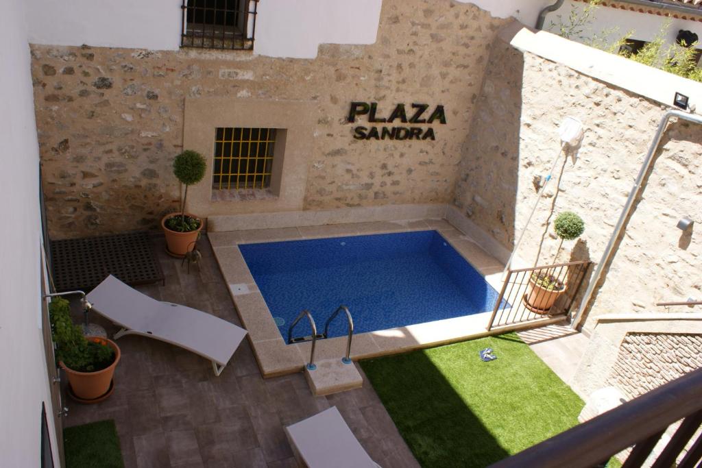 an overhead view of a swimming pool in a building at Plaza Sandra in Trujillo