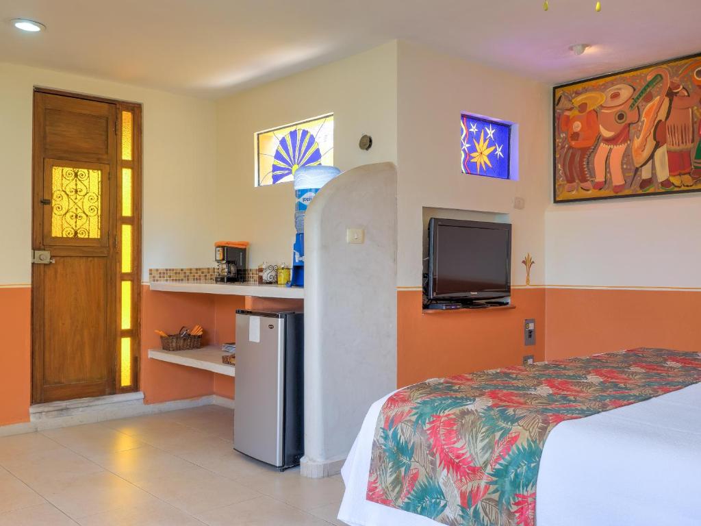 TV a/nebo společenská místnost v ubytování Hotel Luz en Yucatan