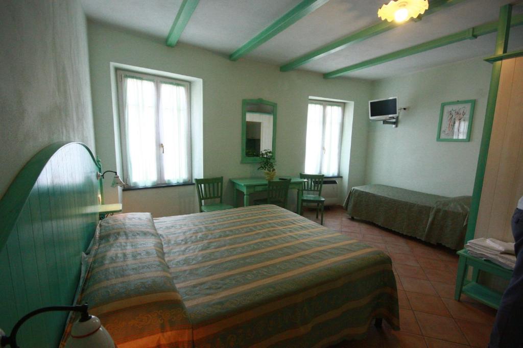 Voodi või voodid majutusasutuse Albergo Belvedere toas