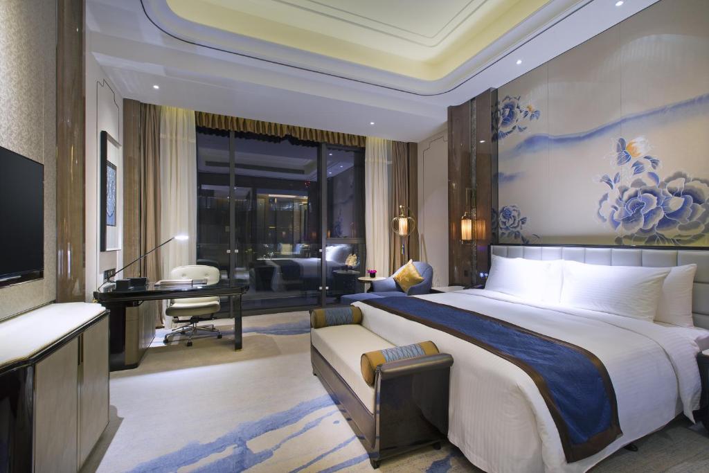 Postel nebo postele na pokoji v ubytování Wanda Vista Kunming