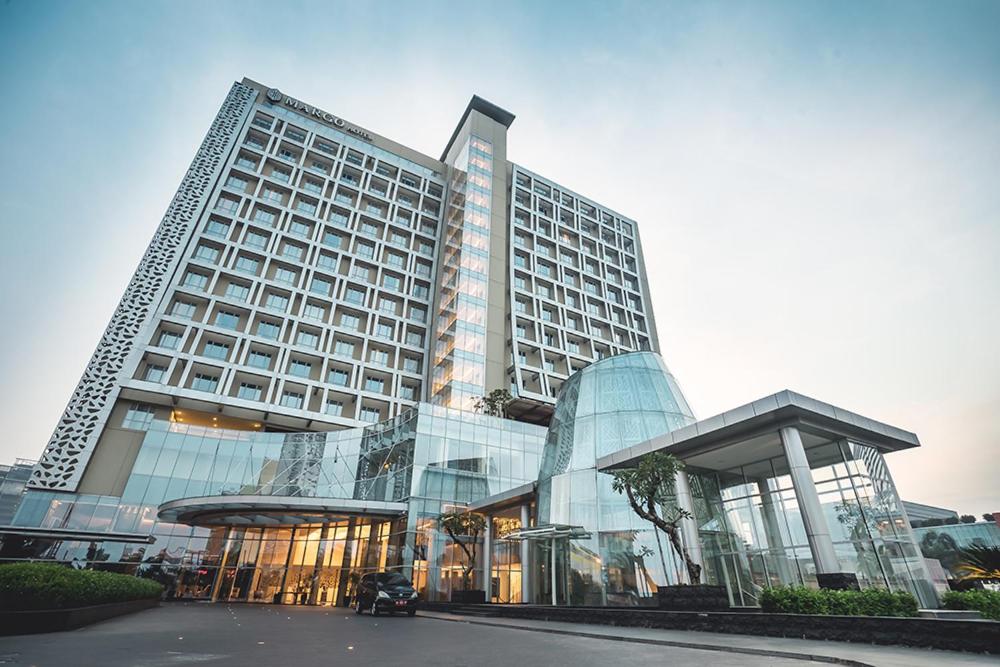 a large building with a lot of glass at The Margo Hotel in Depok