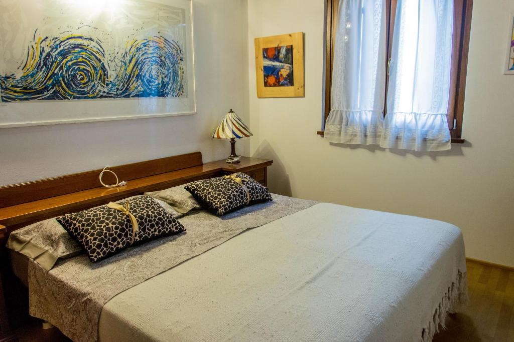 Postel nebo postele na pokoji v ubytování B&B Ca'neva