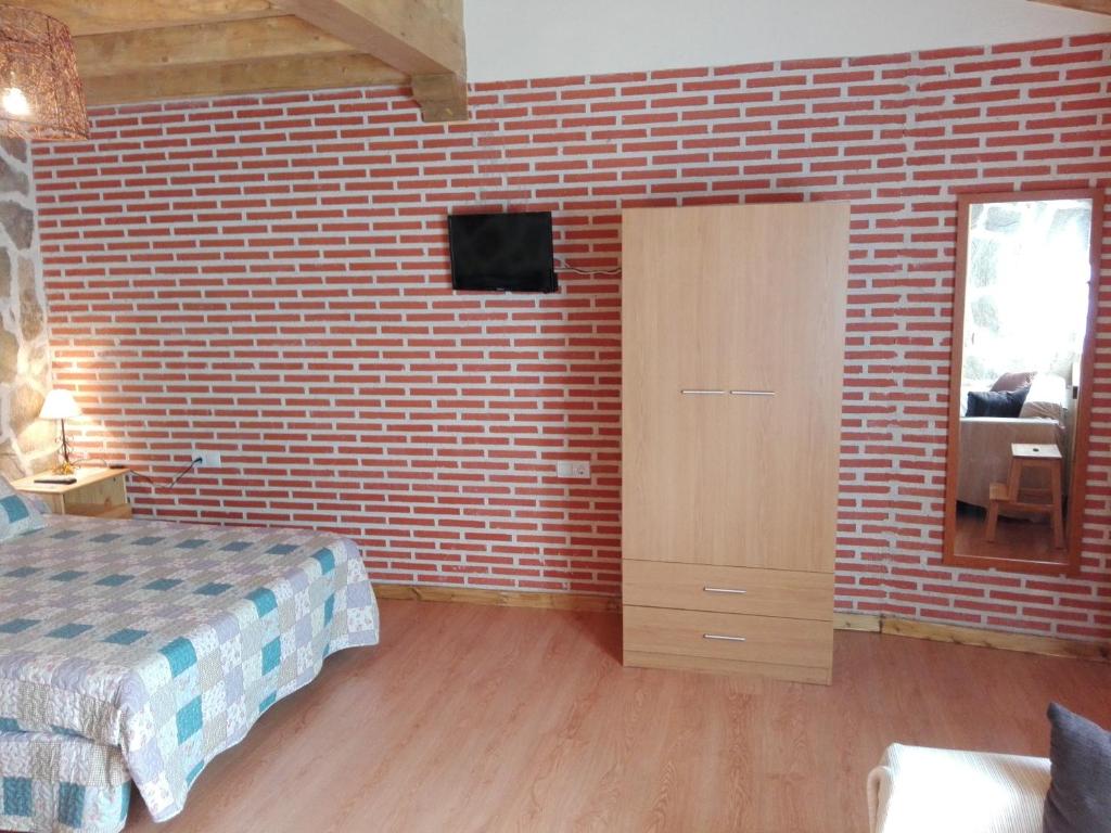 A bed or beds in a room at Abadía del Marqués de Avila