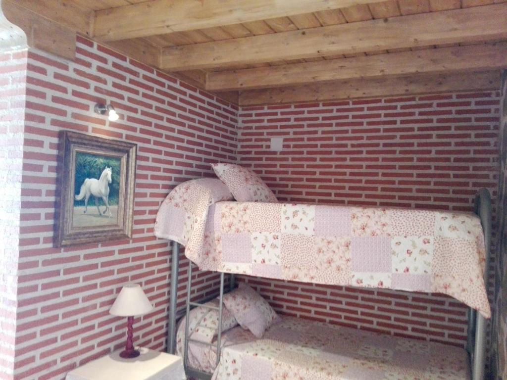 A bed or beds in a room at Abadía del Marqués de Avila