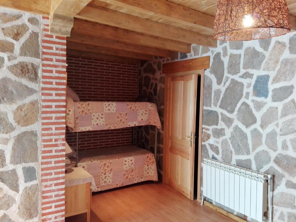 A bed or beds in a room at Abadía del Marqués de Avila