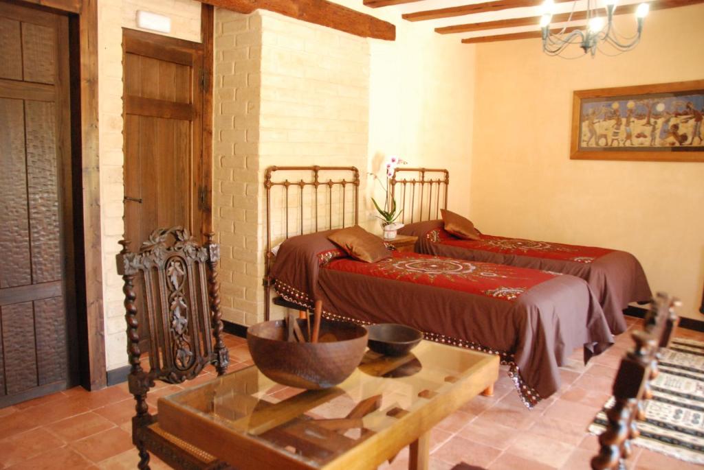 Lova arba lovos apgyvendinimo įstaigoje La Casa de Alberto